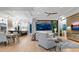 Open concept living space with light floors, comfy seating, and large windows at 9224 Starry Night Ave, Sarasota, FL 34241