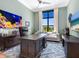 Home office with large desk, comfortable seating and natural light at 9224 Starry Night Ave, Sarasota, FL 34241