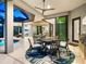 Covered outdoor dining area with stylish furniture at 9224 Starry Night Ave, Sarasota, FL 34241