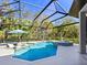 Stunning pool and spa with a covered patio and lush landscaping at 9224 Starry Night Ave, Sarasota, FL 34241