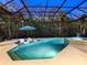Relaxing pool and spa with covered lanai, lounge chairs, and fountain feature at 9224 Starry Night Ave, Sarasota, FL 34241