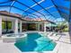 Luxury pool and spa with a covered patio and outdoor seating at 9224 Starry Night Ave, Sarasota, FL 34241