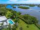 Aerial view of the property showing the waterfront setting at 931 Bayshore Rd, Nokomis, FL 34275