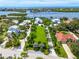 Waterfront property with expansive lot and neighboring homes at 931 Bayshore Rd, Nokomis, FL 34275