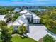 Luxury waterfront home with expansive driveway and landscaping at 931 Bayshore Rd, Nokomis, FL 34275