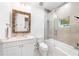 Bathroom with white vanity, bathtub, and a modern glass shower at 931 Bayshore Rd, Nokomis, FL 34275