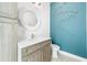 Modern bathroom with a stylish vanity and unique wall art at 931 Bayshore Rd, Nokomis, FL 34275