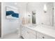 Modern bathroom with a white vanity and large mirror at 931 Bayshore Rd, Nokomis, FL 34275