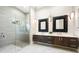 Elegant bathroom with double vanity and frameless shower at 931 Bayshore Rd, Nokomis, FL 34275