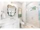 Modern bathroom with white vanity and glass shower at 931 Bayshore Rd, Nokomis, FL 34275