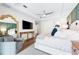 Main bedroom with king-size bed and large TV at 931 Bayshore Rd, Nokomis, FL 34275