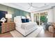 Main bedroom with a king-size bed and water view at 931 Bayshore Rd, Nokomis, FL 34275