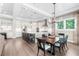 Open dining area with a large wood table and kitchen access, great for entertaining at 931 Bayshore Rd, Nokomis, FL 34275