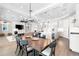 Elegant dining room with a large wooden table and chandelier at 931 Bayshore Rd, Nokomis, FL 34275