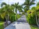 Private gated entrance with lush landscaping at 931 Bayshore Rd, Nokomis, FL 34275