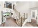 Two-story foyer with hardwood floors and staircase at 931 Bayshore Rd, Nokomis, FL 34275