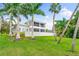 Modern home with lush landscaping and waterfront views at 931 Bayshore Rd, Nokomis, FL 34275