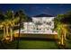 Luxury waterfront home illuminated at night at 931 Bayshore Rd, Nokomis, FL 34275