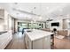 Open concept kitchen with large island, modern appliances, and water views at 931 Bayshore Rd, Nokomis, FL 34275