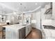 Modern kitchen with white cabinets, large island, stainless steel appliances, and quartz countertops at 931 Bayshore Rd, Nokomis, FL 34275