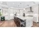 Modern kitchen with white cabinets, large island, and quartz countertops at 931 Bayshore Rd, Nokomis, FL 34275