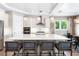 Modern kitchen with white cabinets, large island, and quartz countertops at 931 Bayshore Rd, Nokomis, FL 34275