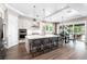 Open kitchen boasting modern appliances, white cabinets, and a large island with seating at 931 Bayshore Rd, Nokomis, FL 34275
