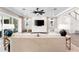 Living area with a fireplace and large TV at 931 Bayshore Rd, Nokomis, FL 34275