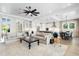 Open living space with kitchen and dining area, featuring hardwood floors and modern design at 931 Bayshore Rd, Nokomis, FL 34275