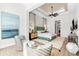 Main bedroom with sitting area and large artwork at 931 Bayshore Rd, Nokomis, FL 34275