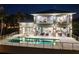 Night view of the home, showcasing its exterior and pool at 931 Bayshore Rd, Nokomis, FL 34275