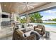 Relaxing outdoor living space with comfortable seating and waterfront views at 931 Bayshore Rd, Nokomis, FL 34275