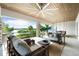 Spacious covered patio with comfortable seating and water views at 931 Bayshore Rd, Nokomis, FL 34275