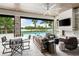 Relaxing outdoor patio with fireplace and pool view at 931 Bayshore Rd, Nokomis, FL 34275