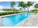 Inviting rectangular pool with spa and waterfront views at 931 Bayshore Rd, Nokomis, FL 34275