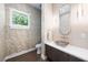 Stylish powder room with modern vanity and patterned wallpaper at 931 Bayshore Rd, Nokomis, FL 34275