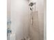 Spa-like shower with pebble floor and rainfall shower head at 931 Bayshore Rd, Nokomis, FL 34275