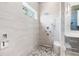 Spa-like shower with pebble floor and modern fixtures at 931 Bayshore Rd, Nokomis, FL 34275
