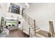 Grand staircase with wood steps and cable railing at 931 Bayshore Rd, Nokomis, FL 34275