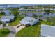 Aerial view of waterfront property with lush landscaping and canal access at 9428 Concord Cir, Bradenton, FL 34210