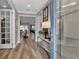 Light-filled entryway, hardwood floors, and French doors at 10739 Spring Tide Way, Parrish, FL 34219