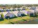 Aerial view of houses near a pond at 11380 Burgundy Dr, Venice, FL 34293