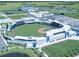 Aerial view showcases the full baseball stadium in a well-maintained, green area at 11380 Burgundy Dr, Venice, FL 34293