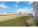Spacious backyard with canal views, offering a serene setting for outdoor enjoyment and relaxation at 11380 Burgundy Dr, Venice, FL 34293