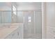 Bathroom with a glass enclosed shower, light gray tile and modern fixtures at 11380 Burgundy Dr, Venice, FL 34293