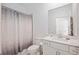 Bathroom featuring a shower/tub combo, toilet, sink and neutral walls at 11380 Burgundy Dr, Venice, FL 34293