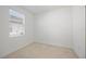 Bright, empty bedroom with ample natural light, neutral walls, and tiled floors creates a versatile space at 11380 Burgundy Dr, Venice, FL 34293
