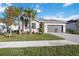 Charming single-Gathering home featuring a two-car garage, well-manicured lawn, and elegant landscaping at 11380 Burgundy Dr, Venice, FL 34293