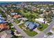 Aerial view showcasing the house and surrounding neighborhood at 120 Lookout Point Dr, Osprey, FL 34229