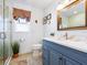 Updated bathroom with a shower, vanity, and decorative mirror at 120 Lookout Point Dr, Osprey, FL 34229
